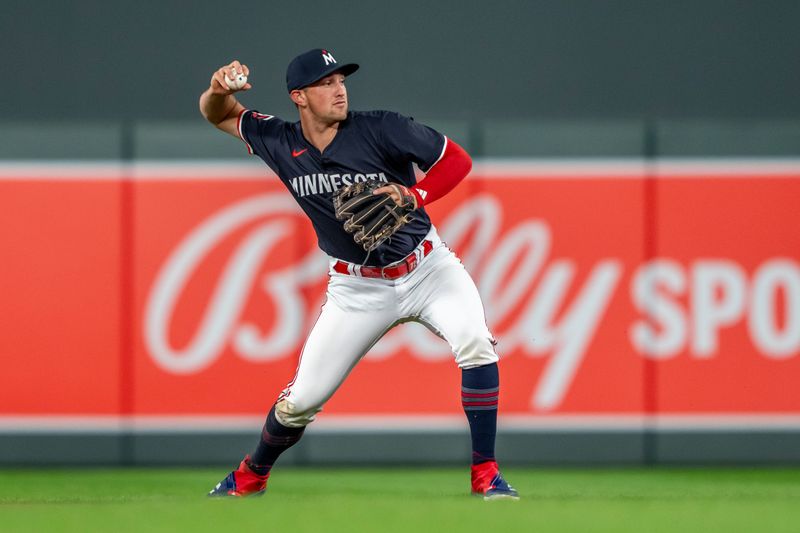 Jul 22, 2024; Minneapolis, Minnesota, USA; Minnesota Twins second baseman Brooks Lee (72) throws the ball to first base for an out against the Philadelphia Phillies in the fifth inning at Target Field. Mandatory Credit: Jesse Johnson-USA TODAY Sports