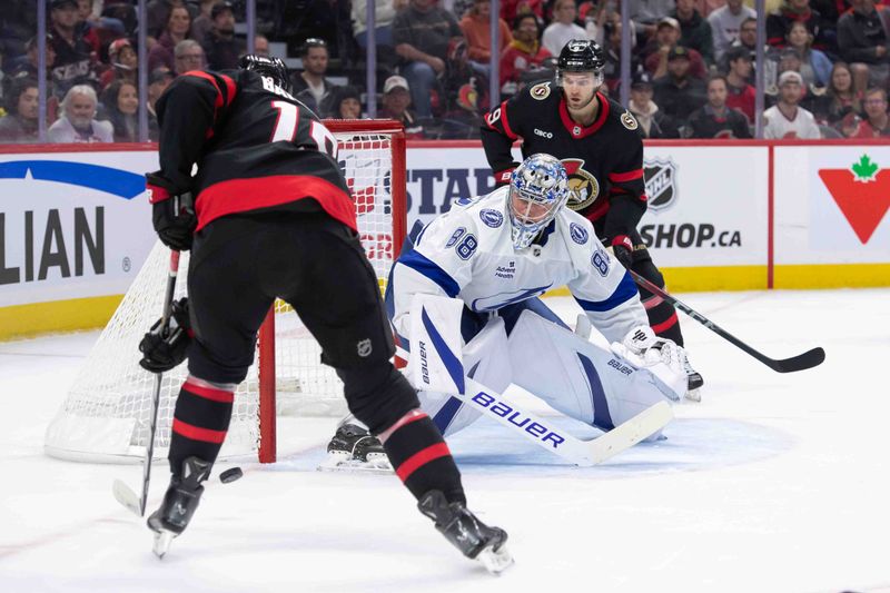 Oct 19, 2024; Ottawa, Ontario, CAN; Ottawa Senators right wing Drake Batherson (19) moves the puck in front of Tampa Bay Lightning goalie Andrei Vasilevskiy (88) in the first period at the Canadian Tire Centre. Mandatory Credit: Marc DesRosiers-Imagn Images