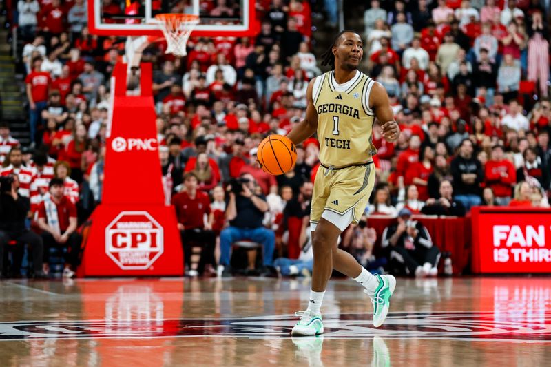 Jan 17, 2026; Raleigh, North Carolina, USA;  Georgia Tech Yellow Jackets guard Lamar Washington (1) dribbles with the ball during the first half of the game against the NC State Wolfpack at Lenovo Center. Mandatory Credit: Jaylynn Nash-Imagn Images