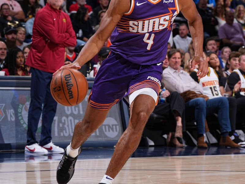 DENVER, CO - OCTOBER 13: Oso Ighodaro #4 of the Phoenix Suns drives to the basket during the game against the Denver Nuggets on October 13, 2024 at Ball Arena in Denver, Colorado. NOTE TO USER: User expressly acknowledges and agrees that, by downloading and/or using this Photograph, user is consenting to the terms and conditions of the Getty Images License Agreement. Mandatory Copyright Notice: Copyright 2024 NBAE (Photo by Garrett Ellwood/NBAE via Getty Images)