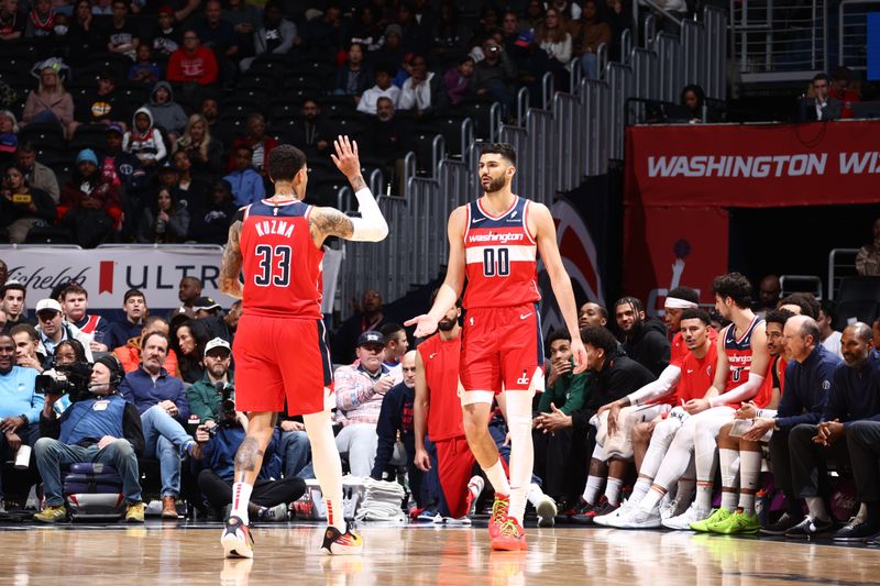 WASHINGTON, DC -? MARCH 27: Tristan Vukcevic #00 high fives Kyle Kuzma #33 of the Washington Wizards during the game against the Brooklyn Nets on March 27, 2024 NBAE at Capital One Arena in Washington, DC. NOTE TO USER: User expressly acknowledges and agrees that, by downloading and or using this Photograph, user is consenting to the terms and conditions of the Getty Images License Agreement. Mandatory Copyright Notice: Copyright 2024 NBAE (Photo by Kenny Giarla/NBAE via Getty Images)