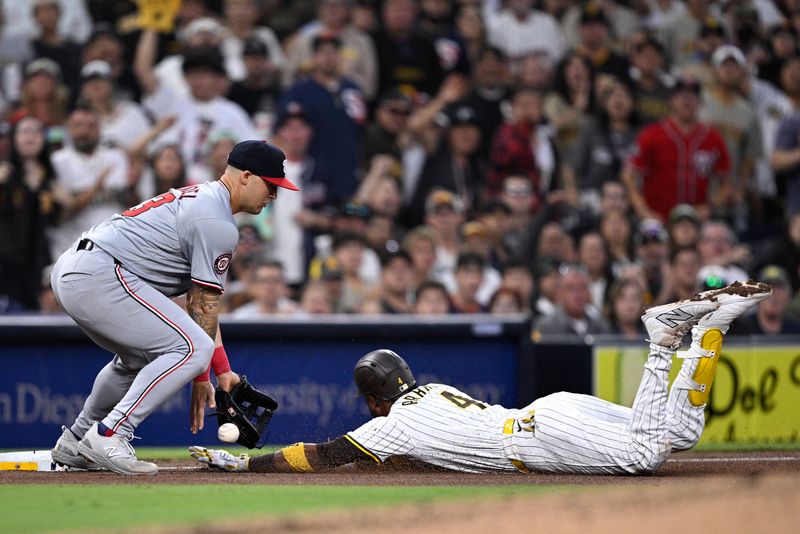 Jun 25, 2024; San Diego, California, USA; San Diego Padres first baseman Luis Arraez (4) slides into third base safely past Washington Nationals third baseman Nick Senzel (13) after hitting a triple during the fifth inning at Petco Park. Mandatory Credit: Orlando Ramirez-USA TODAY Sports