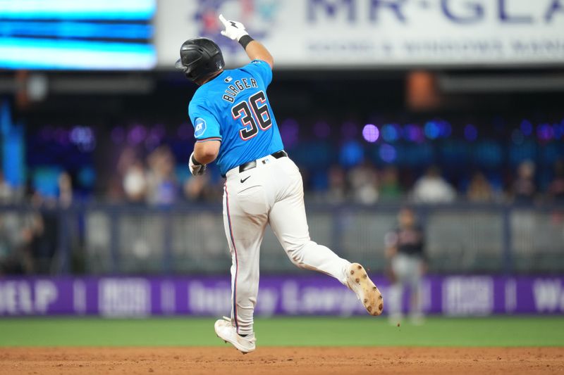 Jun 9, 2024; Miami, Florida, USA;  Miami Marlins third baseman Jake Burger (36) hits a home run in the ninth inning against the Cleveland Guardians at loanDepot Park. Mandatory Credit: Jim Rassol-USA TODAY Sports