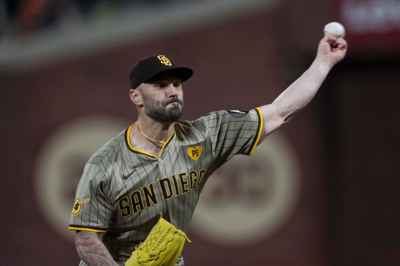 Sep 13, 2024; San Francisco, California, USA;  San Diego Padres relief pitcher Tanner Scott (66) pitches during the seventh inning against the San Francisco Giants at Oracle Park. Mandatory Credit: Stan Szeto-Imagn Images