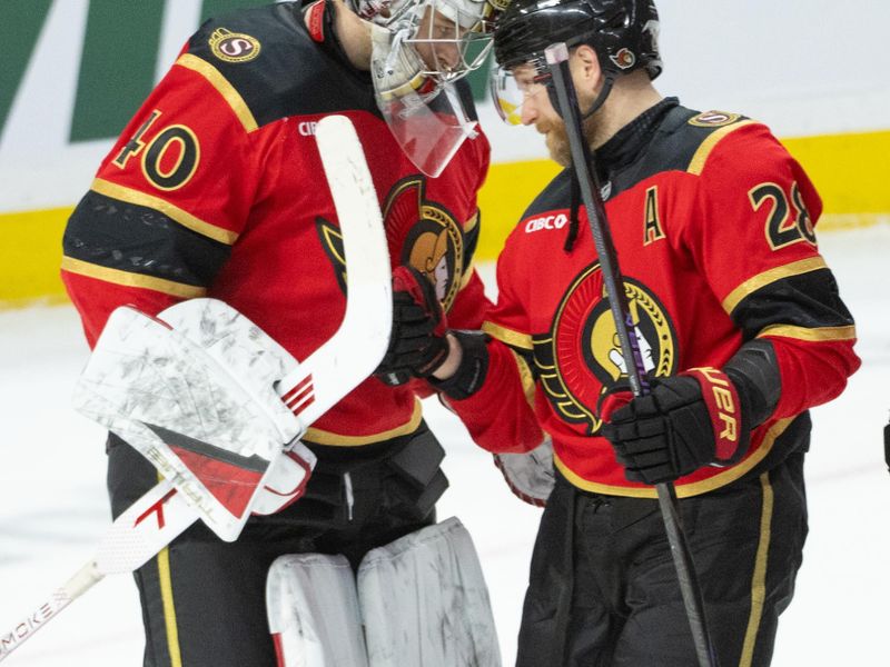 Jan 25, 2026; Ottawa, Ontario, CAN;Ottawa Senators goalie Mads Sogaard (40) is congratulated by right wing Claude Giroux (28) following their win against the Vegas Golden Knights at the Canadian Tire Centre. Mandatory Credit: Marc DesRosiers-IMAGN Images