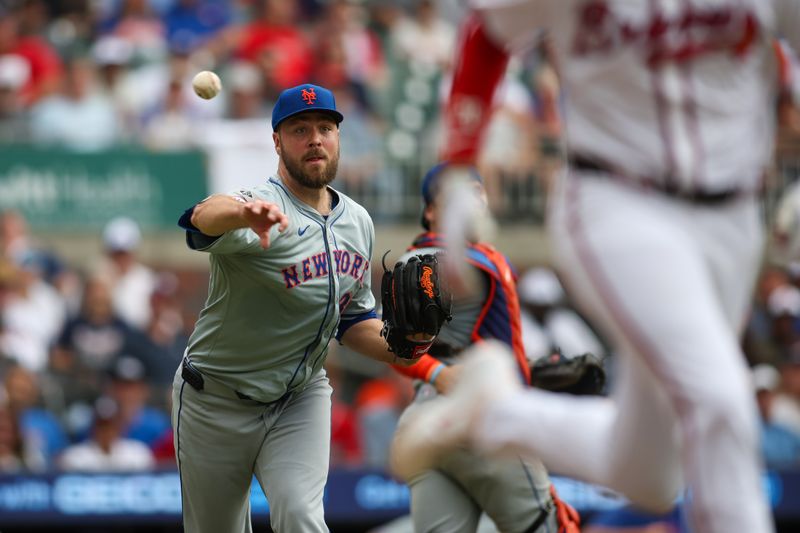Sep 30, 2024; Atlanta, Georgia, USA; New York Mets starting pitcher Tylor Megill (38) throws out  Atlanta Braves first baseman Matt Olson (28) in the fifth inning at Truist Park. Mandatory Credit: Brett Davis-Imagn Images