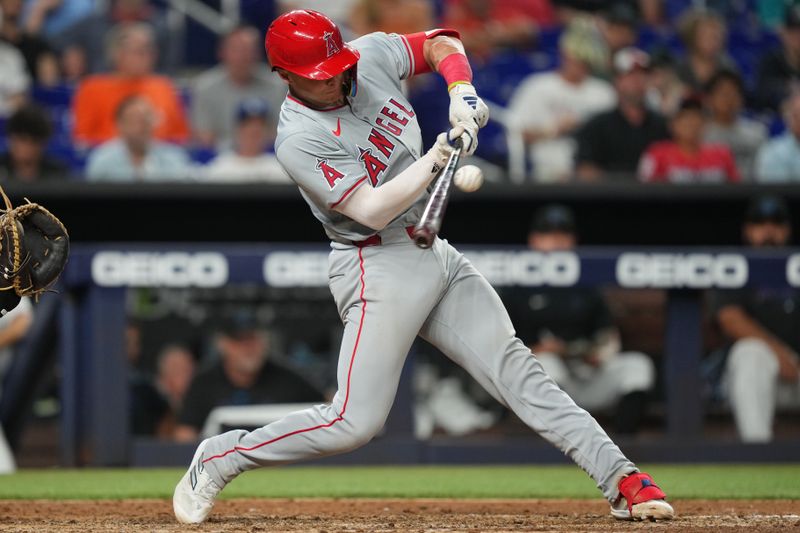 Apr 2, 2024; Miami, Florida, USA; Los Angeles Angels catcher Logan O'Hoppe (14) hits a single in the seventh inning against the Miami Marlins at loanDepot Park. Mandatory Credit: Jim Rassol-USA TODAY Sports