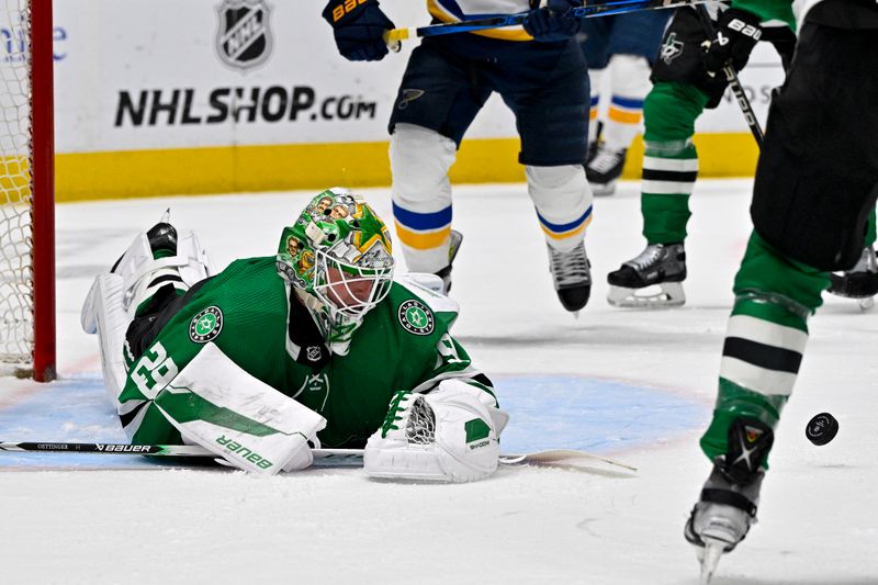 Apr 17, 2024; Dallas, Texas, USA; Dallas Stars goaltender Jake Oettinger (29) makes a diving save on a shot by the St. Louis Blues during the first period at the American Airlines Center. Mandatory Credit: Jerome Miron-USA TODAY Sports