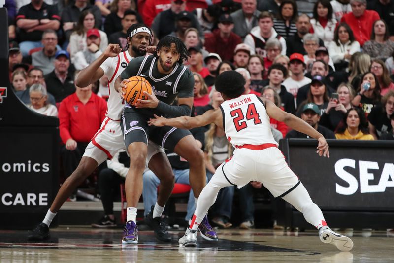 Jan 13, 2024; Lubbock, Texas, USA;  Kansas State Wildcats center Will McNair Jr. (13) keeps the ball from Texas Tech Red Raiders guard Kerwin Walton (24) in the fist half at United Supermarkets Arena. Mandatory Credit: Michael C. Johnson-USA TODAY Sports