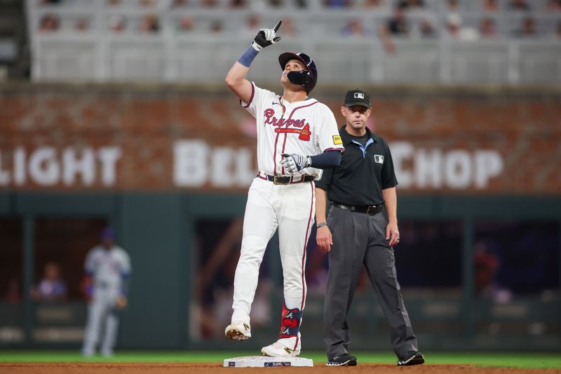 Sep 24, 2024; Atlanta, Georgia, USA; Atlanta Braves third baseman Gio Urshela (9) reacts after a double against the New York Mets in the sixth inning at Truist Park. Mandatory Credit: Brett Davis-Imagn Images