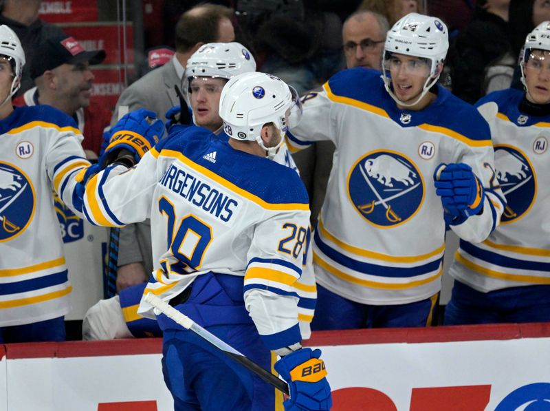 Feb 21, 2024; Montreal, Quebec, CAN; Buffalo Sabres forward Zemgus Girgensons (28) celebrates with teammates after scoring a goal against the Montreal Canadiens during the second period at the Bell Centre. Mandatory Credit: Eric Bolte-USA TODAY Sports