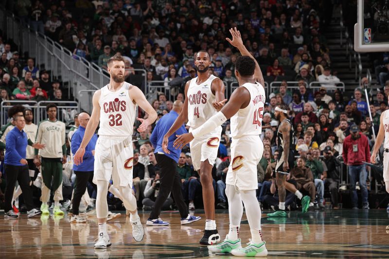 MILWAUKEE, WI - MARCH 9: Donovan Mitchell #45 and Evan Mobley #4 of the Cleveland Cavaliers high five during the game against the Milwaukee Bucks on March 9, 2025 at Fiserv Forum Center in Milwaukee, Wisconsin. NOTE TO USER: User expressly acknowledges and agrees that, by downloading and or using this Photograph, user is consenting to the terms and conditions of the Getty Images License Agreement. Mandatory Copyright Notice: Copyright 2025 NBAE (Photo by Gary Dineen/NBAE via Getty Images). 