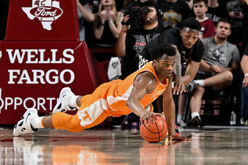 Feb 21, 2023; College Station, Texas, USA;  Tennessee Volunteers forward Tobe Awaka (11) and Texas A&M Aggies guard Wade Taylor IV (4) dive for a loose during the second half at Reed Arena. Mandatory Credit: Maria Lysaker-USA TODAY Sports