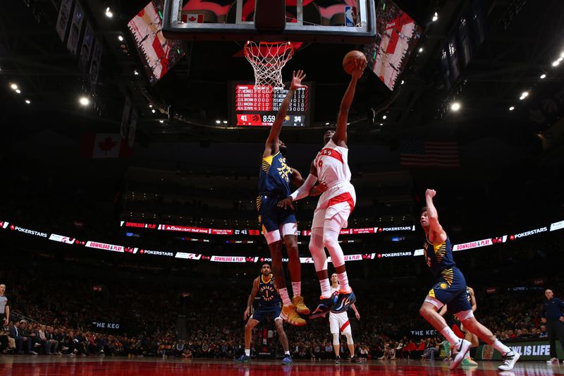 TORONTO, CANADA - APRIL 9:  RJ Barrett #9 of the Toronto Raptors goes to the basket during the game on April 9, 2024 at the Scotiabank Arena in Toronto, Ontario, Canada.  NOTE TO USER: User expressly acknowledges and agrees that, by downloading and or using this Photograph, user is consenting to the terms and conditions of the Getty Images License Agreement.  Mandatory Copyright Notice: Copyright 2024 NBAE (Photo by Vaughn Ridley/NBAE via Getty Images)