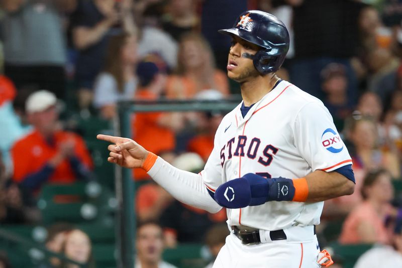 Jun 23, 2024; Houston, Texas, USA;  Houston Astros shortstop Jeremy Pena (3) reacts after he scored on Houston Astros first baseman Mauricio Dubon (14) (not pictured) RBI single against the Baltimore Orioles in the first inning at Minute Maid Park. Mandatory Credit: Thomas Shea-USA TODAY Sports