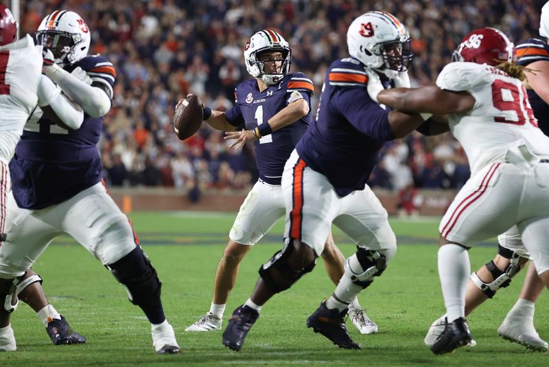 Nov 25, 2023; Auburn, Alabama, USA;  Auburn Tigers quarterback Payton Thorne (1) drops back to pass during the fourth quarter against the Alabama Crimson Tide at Jordan-Hare Stadium. Mandatory Credit: John Reed-USA TODAY Sports