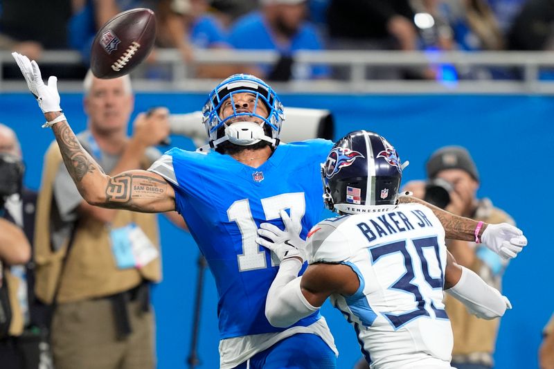 Tennessee Titans cornerback Darrell Baker Jr. (39) breaks up a pass intended for Detroit Lions wide receiver Tim Patrick (17) during the second half of an NFL football game Sunday, Oct. 27, 2024, in Detroit. (AP Photo/Carlos Osorio)