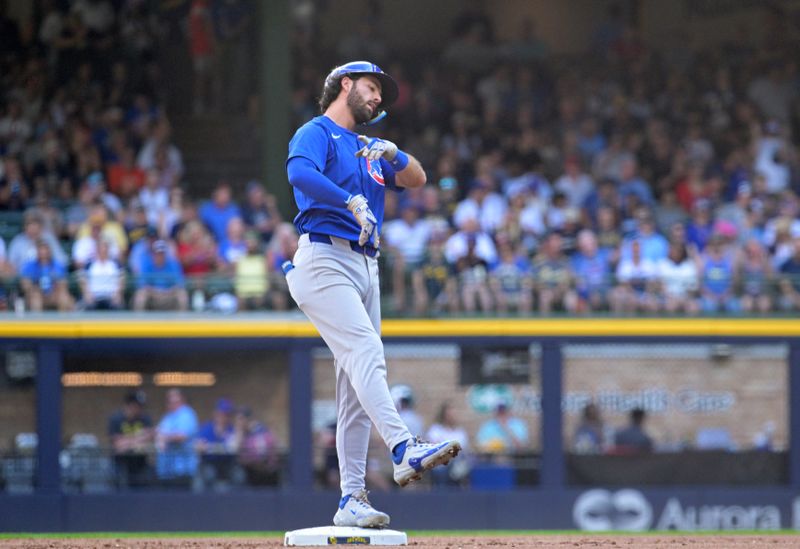 Jun 29, 2024; Milwaukee, Wisconsin, USA; Chicago Cubs shortstop Dansby Swanson (7) celebrates hitting a double in the third inning against the Milwaukee Brewers  at American Family Field. Mandatory Credit: Michael McLoone-USA TODAY Sports