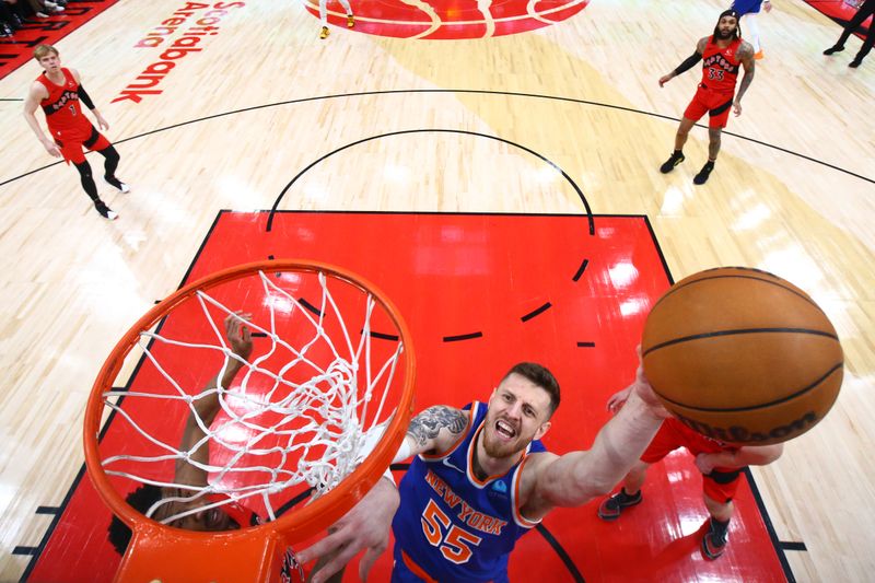 TORONTO, CANADA - MARCH 27: Isaiah Hartenstein #55 of the New York Knicks drives to the basket during the game against the Toronto Raptors on March 27, 2024 at the Scotiabank Arena in Toronto, Ontario, Canada.  NOTE TO USER: User expressly acknowledges and agrees that, by downloading and or using this Photograph, user is consenting to the terms and conditions of the Getty Images License Agreement.  Mandatory Copyright Notice: Copyright 2024 NBAE (Photo by Vaughn Ridley/NBAE via Getty Images)