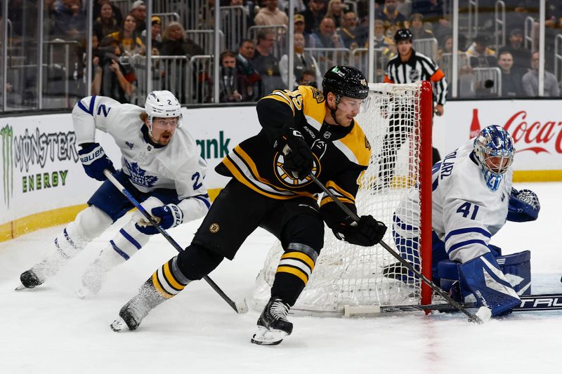 Oct 26, 2024; Boston, Massachusetts, USA; Boston Bruins left wing Cole Koepke (45) tries to stuff the puck past Toronto Maple Leafs goaltender Anthony Stolarz (41) slides over during the first period at TD Garden. Mandatory Credit: Winslow Townson-Imagn Images