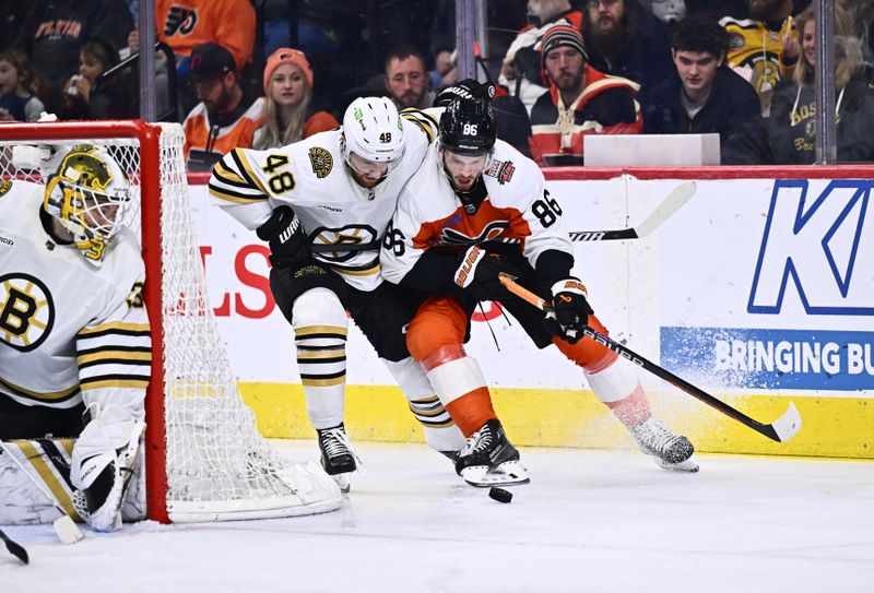 Jan 27, 2024; Philadelphia, Pennsylvania, USA; Philadelphia Flyers left wing Joel Farabee (86) and Boston Bruins defenseman Matt Grzelcyk (48) chase the puck in the second period at Wells Fargo Center. Mandatory Credit: Kyle Ross-USA TODAY Sports