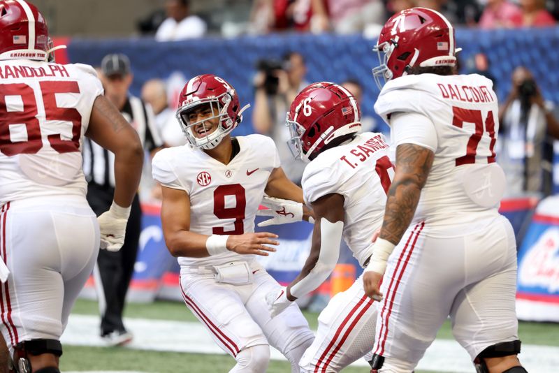 Sep 4, 2021; Atlanta, Georgia, USA; Alabama Crimson Tide quarterback Bryce Young (9) reacts after running back Trey Sanders (6) scored a touchdown during the third quarter of their game against the Miami Hurricanes at Mercedes-Benz Stadium. Mandatory Credit: Jason Getz-USA TODAY Sports