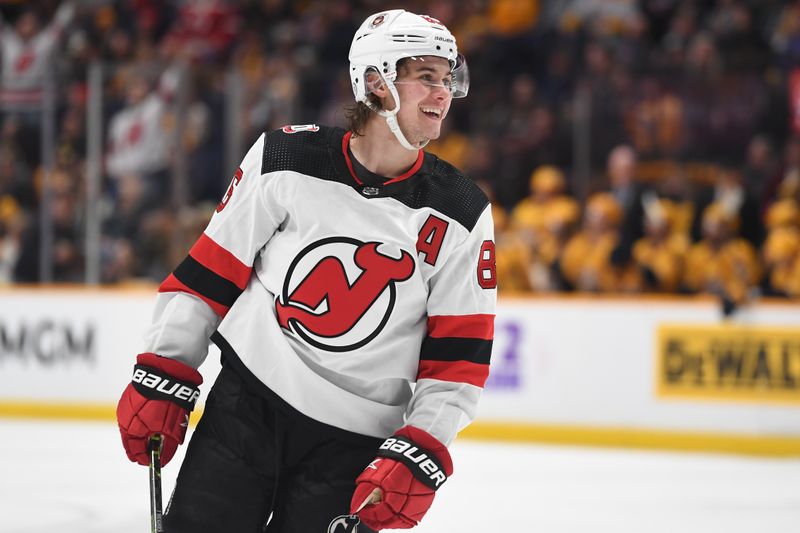 Jan 26, 2023; Nashville, Tennessee, USA; New Jersey Devils center Jack Hughes (86) celebrate after a goal during the second period against the Nashville Predators at Bridgestone Arena. Mandatory Credit: Christopher Hanewinckel-USA TODAY Sports