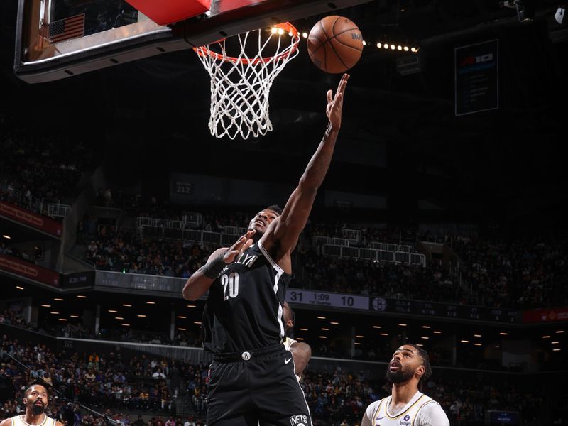 BROOKLYN, NY - MARCH 31: Day'Ron Sharpe #20 of the Brooklyn Nets goes to the basket during the game on March 31, 2024 at Barclays Center in Brooklyn, New York. NOTE TO USER: User expressly acknowledges and agrees that, by downloading and or using this Photograph, user is consenting to the terms and conditions of the Getty Images License Agreement. Mandatory Copyright Notice: Copyright 2024 NBAE (Photo by Nathaniel S. Butler/NBAE via Getty Images)