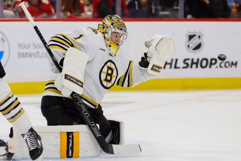 May 14, 2024; Sunrise, Florida, USA; Boston Bruins goaltender Jeremy Swayman (1) makes a save against the Florida Panthers during the second period in game five of the second round of the 2024 Stanley Cup Playoffs at Amerant Bank Arena. Mandatory Credit: Sam Navarro-USA TODAY Sports