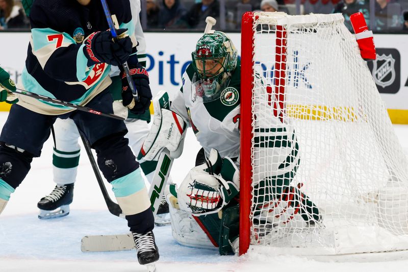 Feb 24, 2024; Seattle, Washington, USA; Minnesota Wild goaltender Marc-Andre Fleury (29) watches play from the net against the Seattle Kraken during the first period at Climate Pledge Arena. Mandatory Credit: Joe Nicholson-USA TODAY Sports