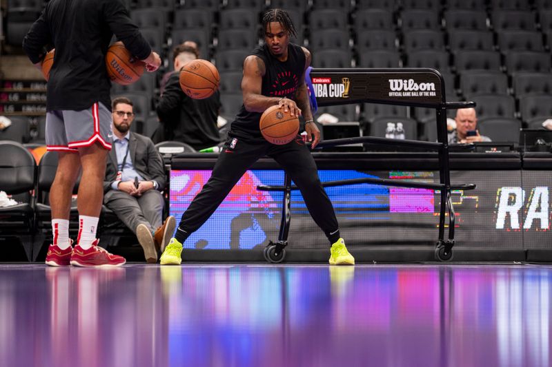 TORONTO, ON - NOVEMBER 15: Davion Mitchell #45 of the Toronto Raptors warms up before facing the Detroit Pistons in the Emirates NBA Cup game at Scotiabank Arena on November 15, 2024 in Toronto, Ontario, Canada. NOTE TO USER: User expressly acknowledges and agrees that, by downloading and/or using this Photograph, user is consenting to the terms and conditions of the Getty Images License Agreement. (Photo by Andrew Lahodynskyj/Getty Images)