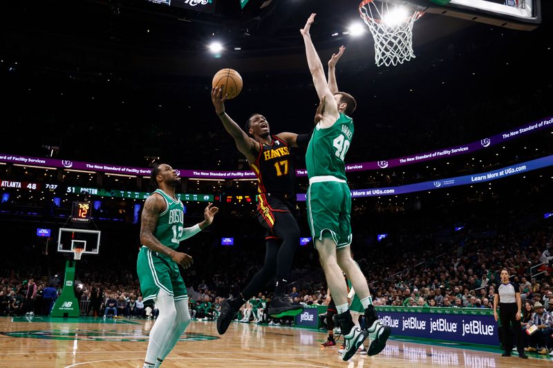 BOSTON, MA - FEBRUARY 7: Onyeka Okongwu #17 of the Atlanta Hawks goes to the basket against Luke Kornet #40 of the Boston Celtics during the second quarter at TD Garden on February 7, 2024 in Boston, Massachusetts. NOTE TO USER: User expressly acknowledges and agrees that, by downloading and/or using this Photograph, user is consenting to the terms and conditions of the Getty Images License Agreement. (Photo By Winslow Townson/Getty Images)