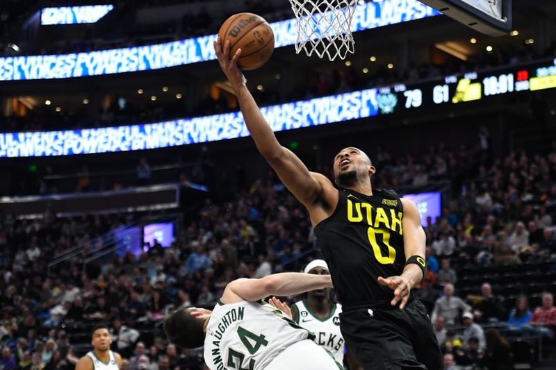 SALT LAKE CITY, UTAH - MARCH 24: Talen Horton-Tucker #0 of the Utah Jazz shoots over Pat Connaughton #24 of the Milwaukee Bucks during the second half of a game at Vivint Arena on March 24, 2023 in Salt Lake City, Utah. NOTE TO USER: User expressly acknowledges and agrees that, by downloading and or using this photograph, User is consenting to the terms and conditions of the Getty Images License Agreement.  (Photo by Alex Goodlett/Getty Images)