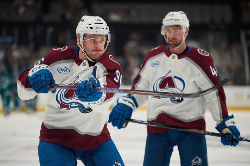 Oct 20, 2024; San Jose, California, USA; Colorado Avalanche right wing Mikko Rantanen (96) and defenseman Calvin de Haan (44) warm up on the ice before the game between the San Jose Sharks and the Colorado Avalanche at SAP Center at San Jose. Mandatory Credit: Robert Edwards-Imagn Images