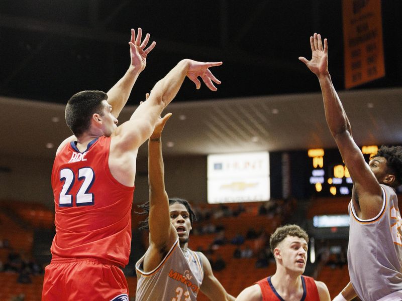 Feb 3, 2024; El Paso, Texas, USA; Liberty University Flames forward Kyle Rode (22) shoots the ball against the UTEP Miners defense in the first half at Don Haskins Center. Mandatory Credit: Ivan Pierre Aguirre-USA TODAY Sports