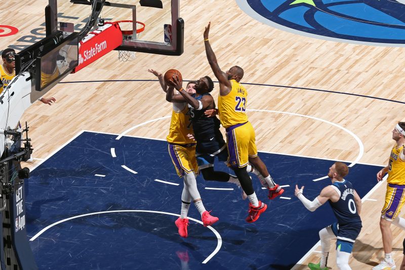 MINNEAPOLIS, MN -  APRIL 25:  Anthony Edwards #5 of the Minnesota Timberwolves drives to the basket during the game against the Los Angeles Lakers   during Round 1 Game 3 of the 2025 NBA Playoffs  on April 25, 2025 at Target Center in Minneapolis, Minnesota. NOTE TO USER: User expressly acknowledges and agrees that, by downloading and or using this Photograph, user is consenting to the terms and conditions of the Getty Images License Agreement. Mandatory Copyright Notice: Copyright 2025 NBAE (Photo by David Sherman/NBAE via Getty Images)