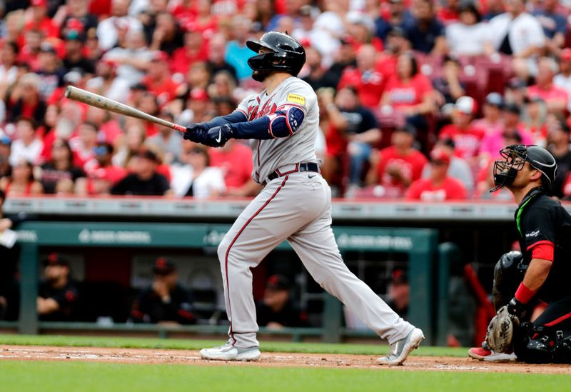 Jun 23, 2023; Cincinnati, Ohio, USA; Atlanta Braves catcher Travis d'Arnaud (16) hits a three-run home run against the Cincinnati Reds during the first inning at Great American Ball Park. Mandatory Credit: David Kohl-USA TODAY Sports