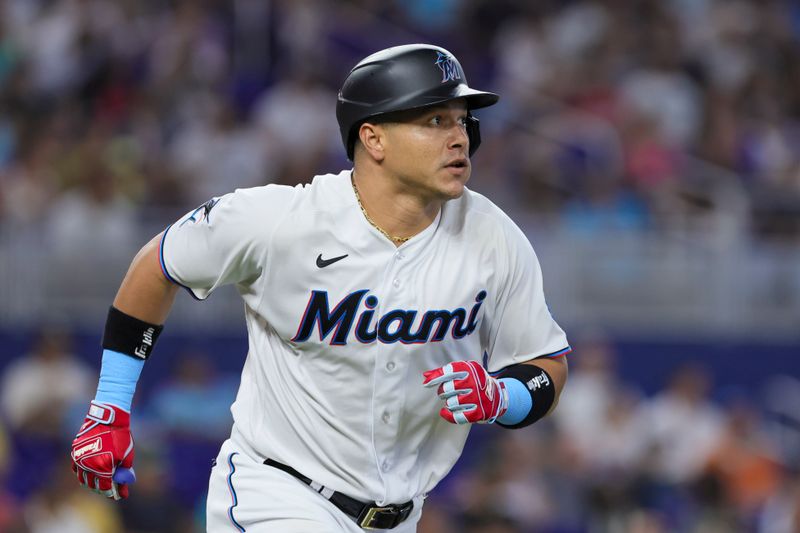 Jul 30, 2023; Miami, Florida, USA; Miami Marlins right fielder Avisail Garcia (24) circles the bases after hitting a triple against the Detroit Tigers during the fifth inning at loanDepot Park. Mandatory Credit: Sam Navarro-USA TODAY Sports