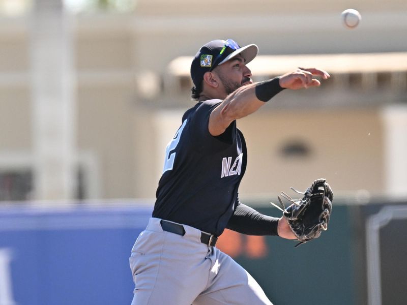 Feb 20, 2026; Sarasota, Florida, USA; New York Yankees shortstop Jose Caballero (72) throws to first base in the second  inning against the Baltimore Orioles during spring training at Ed Smith Stadium. Mandatory Credit: Jonathan Dyer-Imagn Images