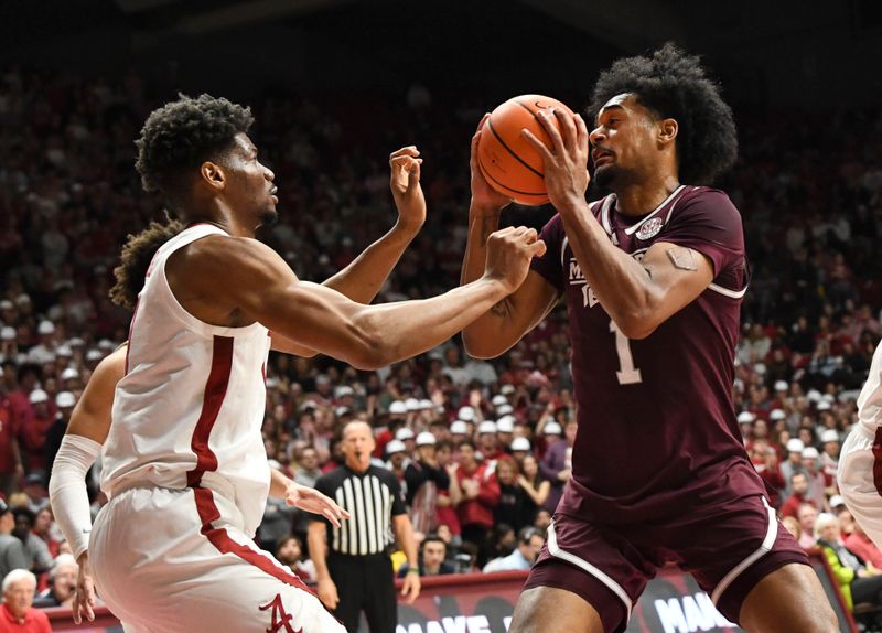 Feb 3, 2024; Tuscaloosa, Alabama, USA;  Mississippi State forward Tolu Smith III (1) looks for a shot against Alabama forward Mohamed Wague (11) at Coleman Coliseum. Mandatory Credit: Gary Cosby Jr.-USA TODAY Sports