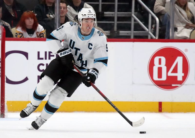 Nov 23, 2024; Pittsburgh, Pennsylvania, USA;  Utah Hockey Club center Clayton Keller (9) skates up ice with the puck against the Pittsburgh Penguins during the second period at PPG Paints Arena. Mandatory Credit: Charles LeClaire-Imagn Images