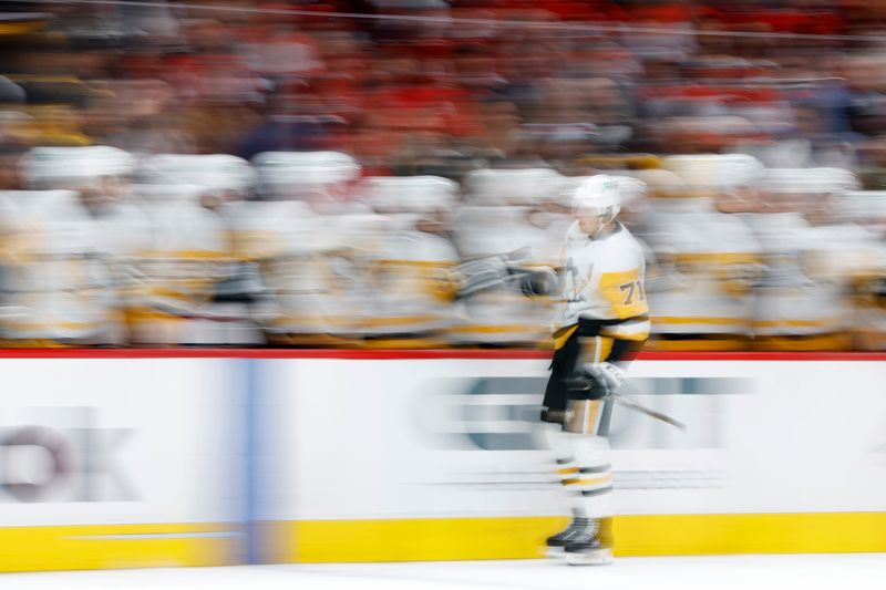 Nov 8, 2024; Washington, District of Columbia, USA; Pittsburgh Penguins center Evgeni Malkin (71) celebrates with teammates after scoring a goal against the Washington Capitals in the third period at Capital One Arena. Mandatory Credit: Geoff Burke-Imagn Images