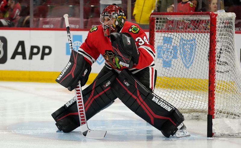 Jan 22, 2023; Chicago, Illinois, USA; Chicago Blackhawks goaltender Petr Mrazek (34) warms up before the game against the Los Angeles Kings at United Center. Mandatory Credit: David Banks-USA TODAY Sports