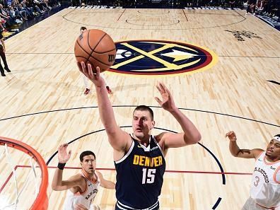 DENVER, CO - NOVEMBER 26: Nikola Jokic #15 of the Denver Nuggets drives to the basket during the game against the San Antonio Spurs on November 26, 2023 at the Ball Arena in Denver, Colorado. NOTE TO USER: User expressly acknowledges and agrees that, by downloading and/or using this Photograph, user is consenting to the terms and conditions of the Getty Images License Agreement. Mandatory Copyright Notice: Copyright 2023 NBAE (Photo by Garrett Ellwood/NBAE via Getty Images)