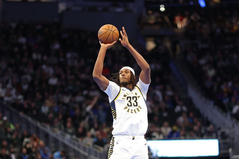 MILWAUKEE, WISCONSIN - NOVEMBER 22: Myles Turner #33 of the Indiana Pacers takes a three point shot during the first half of a game against the Milwaukee Bucks in the NBA Emirates Cup at Fiserv Forum on November 22, 2024 in Milwaukee, Wisconsin. NOTE TO USER: User expressly acknowledges and agrees that, by downloading and or using this photograph, User is consenting to the terms and conditions of the Getty Images License Agreement. (Photo by Stacy Revere/Getty Images)