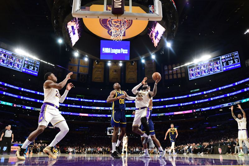 LOS ANGELES, CA - MACH 16: LeBron James #23 of the Los Angeles Lakers drives to the basket during the game against the Golden State Warriors on March 16, 2024 at Crypto.Com Arena in Los Angeles, California. NOTE TO USER: User expressly acknowledges and agrees that, by downloading and/or using this Photograph, user is consenting to the terms and conditions of the Getty Images License Agreement. Mandatory Copyright Notice: Copyright 2024 NBAE (Photo by Adam Pantozzi/NBAE via Getty Images)