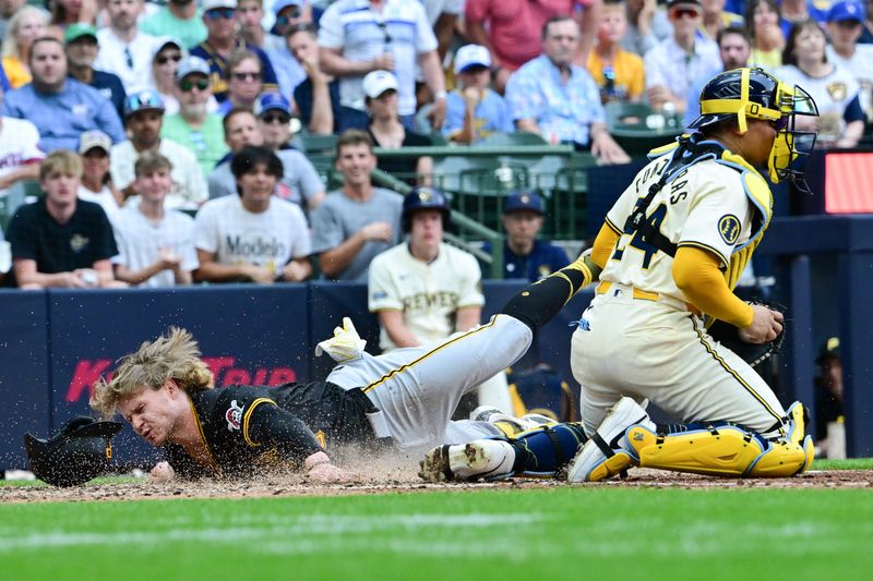 Jul 11, 2024; Milwaukee, Wisconsin, USA; Pittsburgh Pirates center fielder Jack Suwinski (65) scores past Milwaukee Brewers catcher William Contreras (24) in the seventh inning at American Family Field. Mandatory Credit: Benny Sieu-USA TODAY Sports