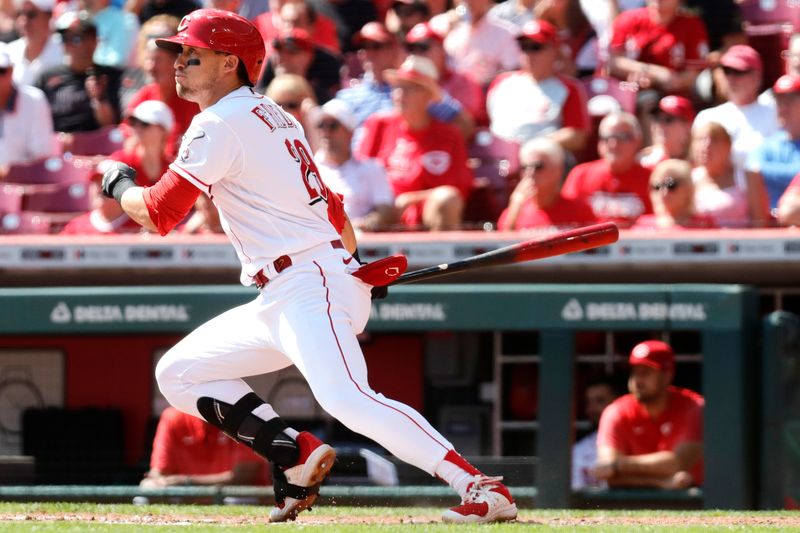 Sep 20, 2023; Cincinnati, Ohio, USA; Cincinnati Reds center fielder TJ Friedl (29) hits an RBI single against the Minnesota Twins during the third inning at Great American Ball Park. Mandatory Credit: David Kohl-USA TODAY Sports