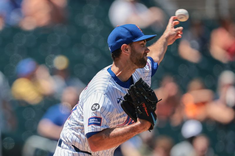 Jul 11, 2024; New York City, New York, USA; New York Mets starting pitcher David Peterson (23) throws the ball ro second base during the first inning against the Washington Nationals at Citi Field. Mandatory Credit: Vincent Carchietta-USA TODAY Sports