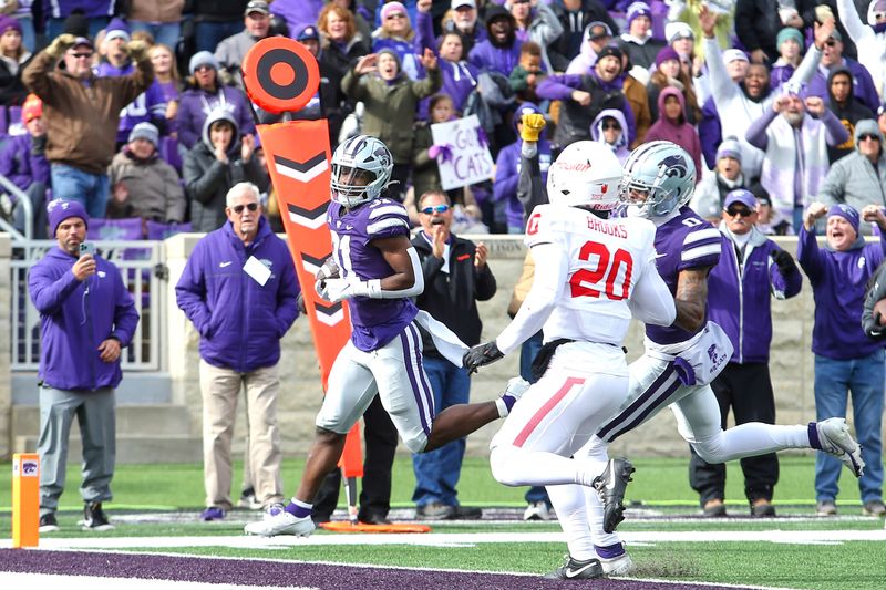 Oct 28, 2023; Manhattan, Kansas, USA; Kansas State Wildcats running back DJ Giddens (31) scores a touchdown in the fourth quarter against the Houston Cougars at Bill Snyder Family Football Stadium. Mandatory Credit: Scott Sewell-USA TODAY Sports